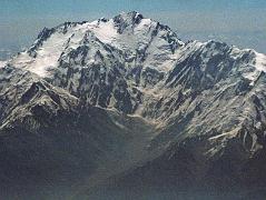 
On the 40-minute flight from Islamabad to Skardu, the captain announces, �We'll be flying at a planned altitude of 8,000 metres.� Perfect I thought, we'll be exactly at the height of Nanga Parbat. The flight starts low key with the stewardesses serving drinks while we bide our time. When the pilot announces �Nanga Parbat is immediately ahead on the right�, all hell breaks loose. As one, all the tourists, including me, are up in the aisles, craning their necks, running for the cockpit. The sounds of cameras are everywhere. There it is, within arms reach. Nanga Parbat in perfect early morning splendor! We are passing by the Diamir Face, as I click photo after photo. The massive Mazeno Ridge runs down to the right of Nanga Parbat. The Mazeno ridge is the longest ridge on any 8000m mountain and includes eight 7000m peaks. Nobody has managed to traverse the ridge and continue to the summit of Nanga Parbat.
